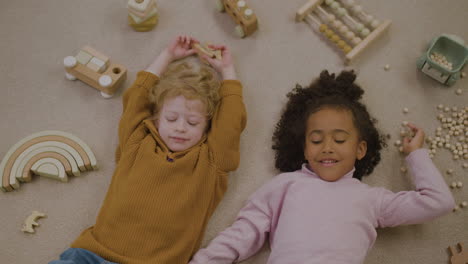 children laughing on the floor