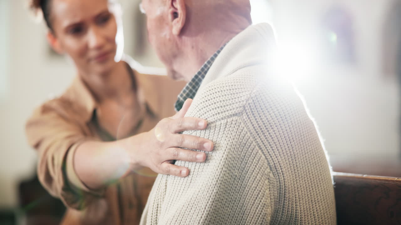 Compassionate caregiver supporting an elderly person