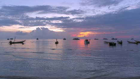 stunning sunset over the ocean with boats