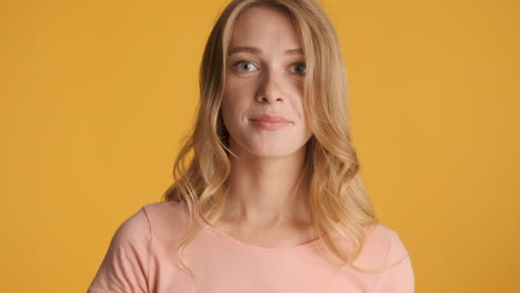 caucasian woman calmly looking at camera.