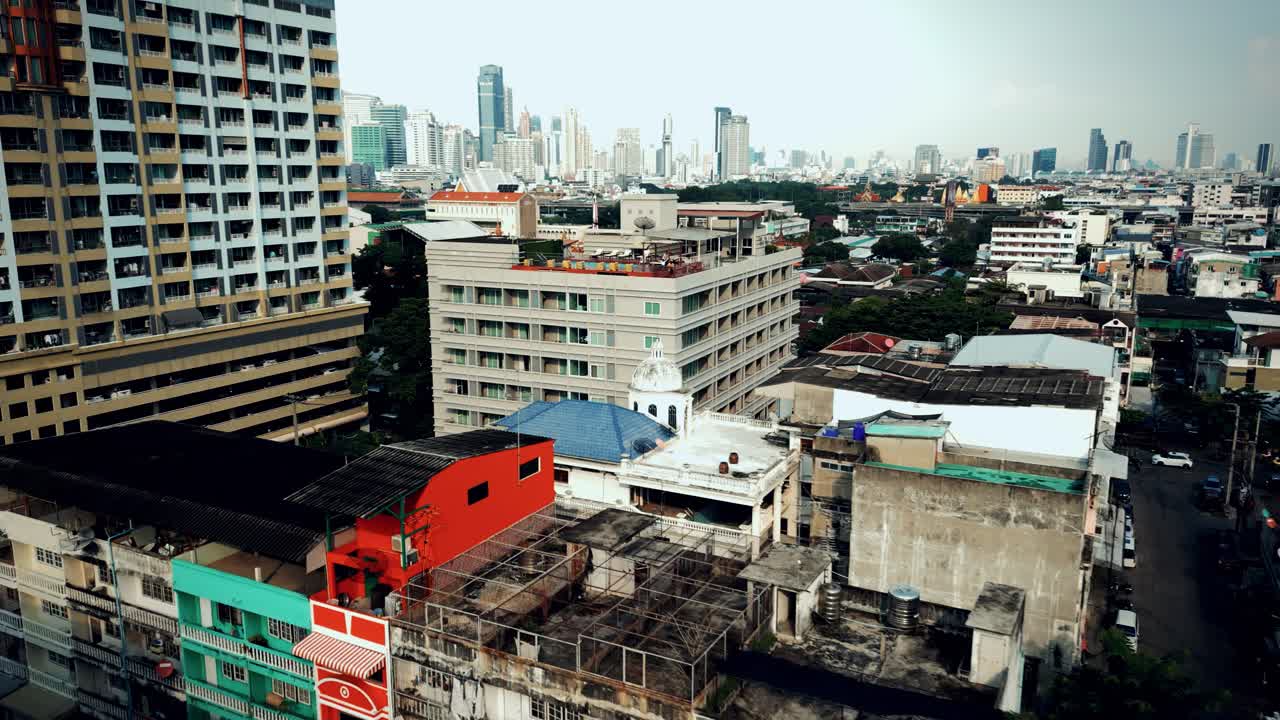 Aerial Scenic Drone Footage of a Rooftop Swimming Pool in Downtown Bangkok, Thailand on a Sunny Day
