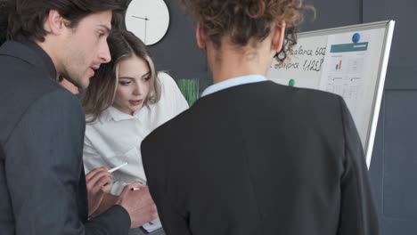 business team discussing over financial reports at office