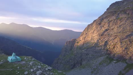 Golden-sunlight-on-cliff-face-high-in-mountains-of-Romania