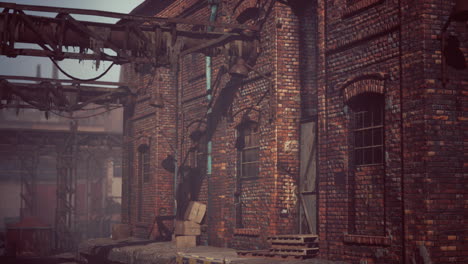 abandoned industrial factory buildings at sunset