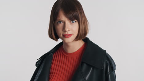 astonished girl in black leather jacket in studio