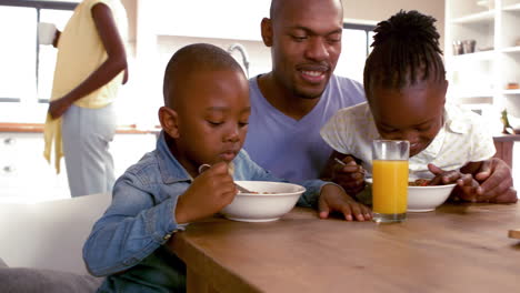 Happy-family-having-breakfast-together-in-the-morning