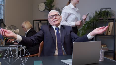 senior old business man shout with aggressive emotion after unsuccessful online deal with client