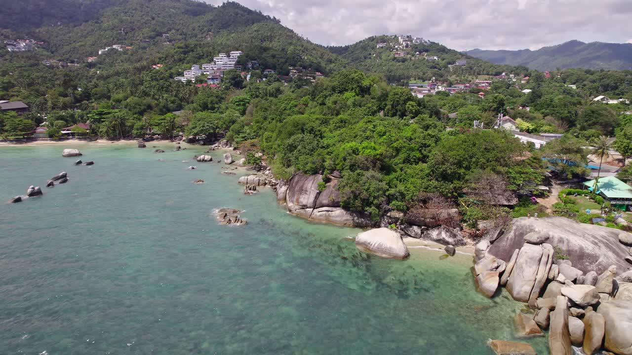 Beautiful 4K drone footage of the beach and unique rock features at Hin Ta Hin Yai Beach on Koh Samui in Thailand