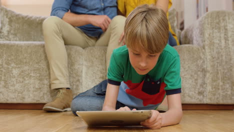 Parents-watching-their-son-use-tablet