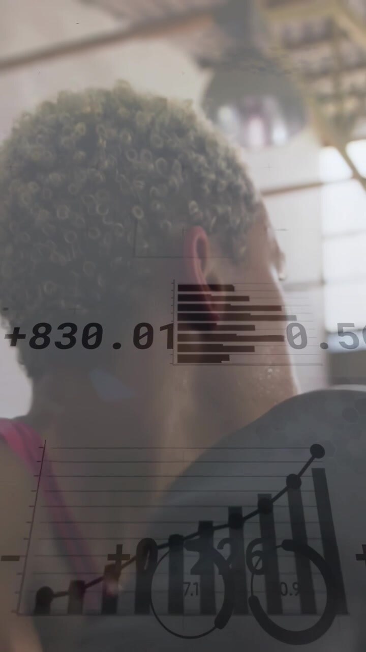 Vertical video: Woman turning head, starting charts scaling while camera rising, reviewing business