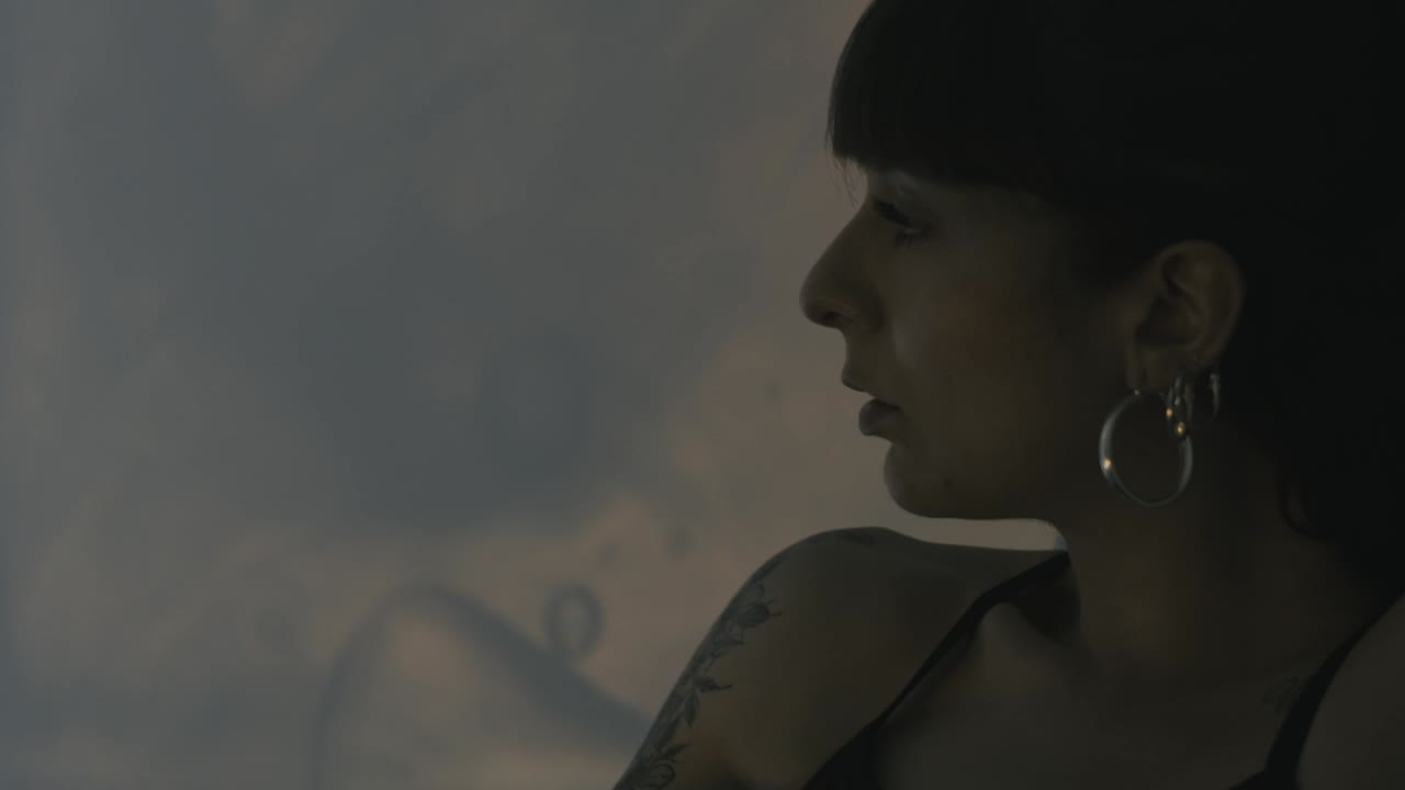 Woman engages in a captivating performance with lights and shadows, narrating a compelling story