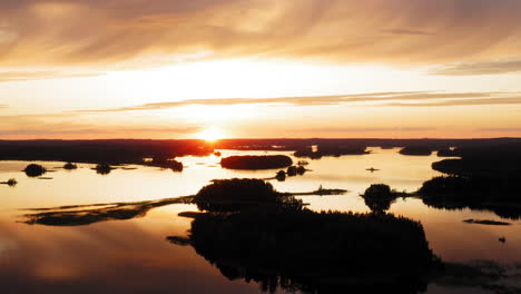 drone shot of stunning golden hour sunset over a lake scenery with many islands