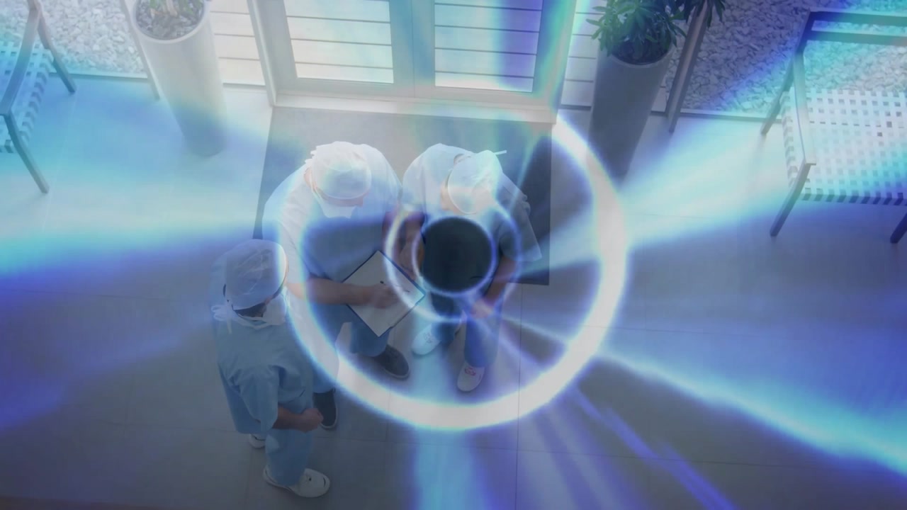 Medical team reviewing chart at hospital entrance initiating spiraling light beams around clipboard