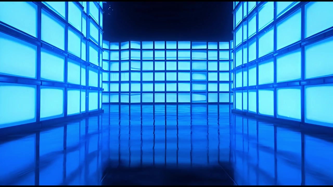 Abstract Background of Glowing Blue Television Screens in a Dark Room