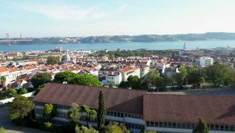 View-of-Tagus-river,-Almada-city-and-25-de-Abril-bridge-from-embankment-in-Lisbon-in-December