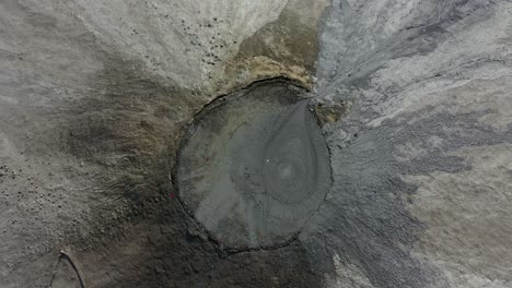 Aerial-Top-Down-View-Into-Mud-Pool-Crater-At-Balochistan