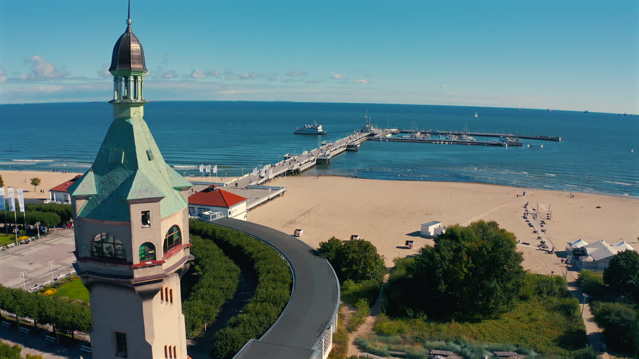 Aerial view of city center in Sopot, drone flying towards the pier at sunny summer day