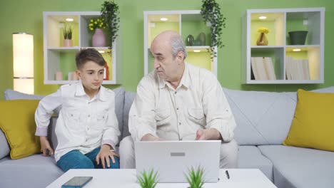 The-boy-gives-a-gift-to-his-grandfather.-Surprise.