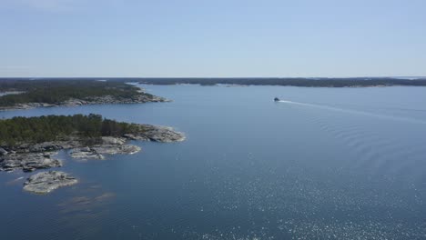 small tugboat making way ahead in finnish archipelago fairway