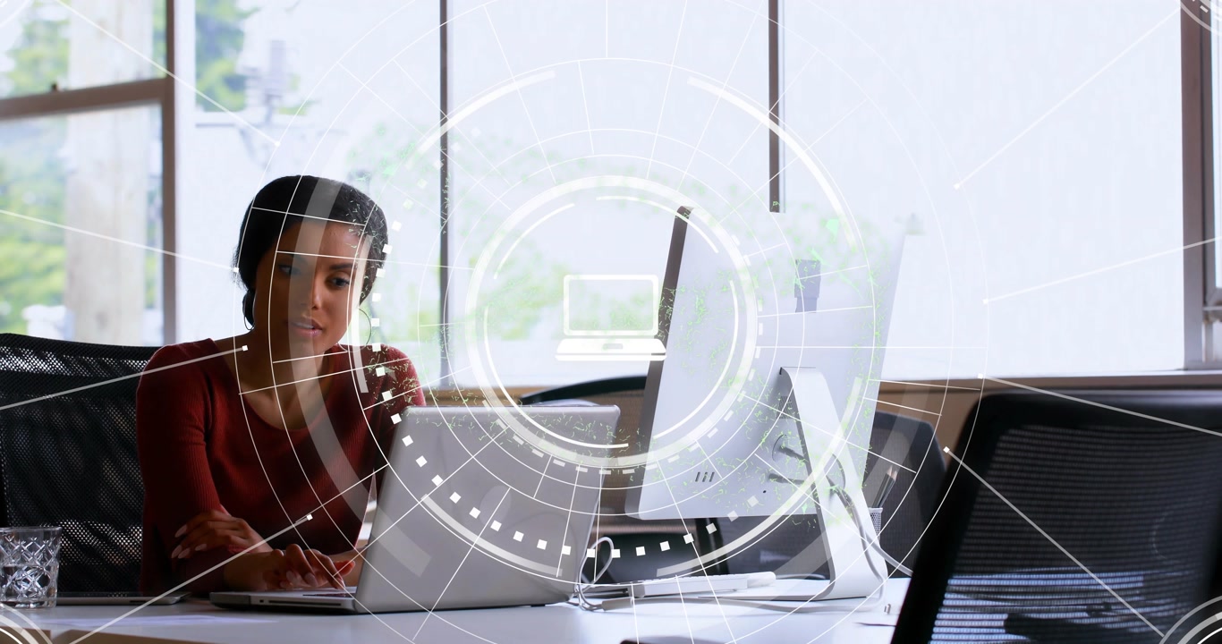 Seated woman using office laptop, colleague entering sharing papers and causing HUD icons animating