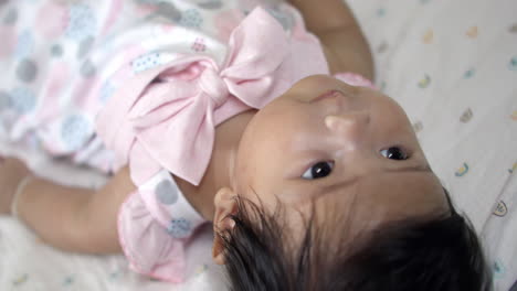 adorable baby girl in pink dress