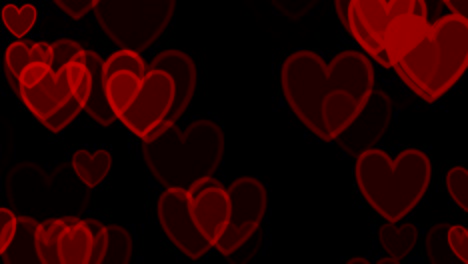 corazones rojos sobre fondo negro
