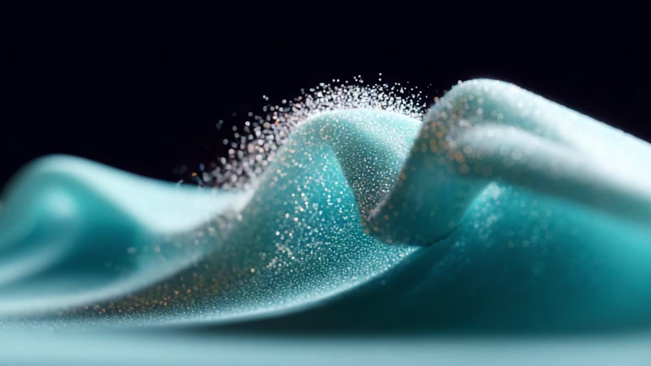 A Mesmerizing Display of Elegance: Captivating Waves of Turquoise Fabric Enhanced by Sparkling Glitter Particles Dancing in the Air and Creating an Ethereal Visual Experience Capturing the Essence of Beauty