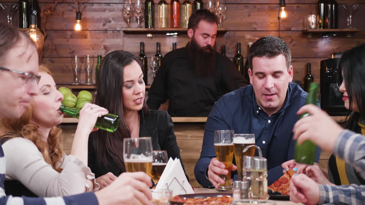 Group of friends celebrating at a restaurant