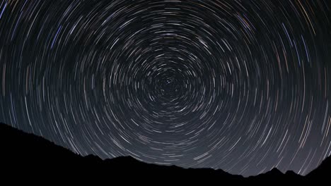 colorful cumulative star trails around the north pole