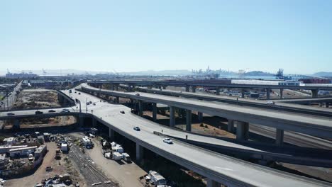 a highway runs above a homeless camp