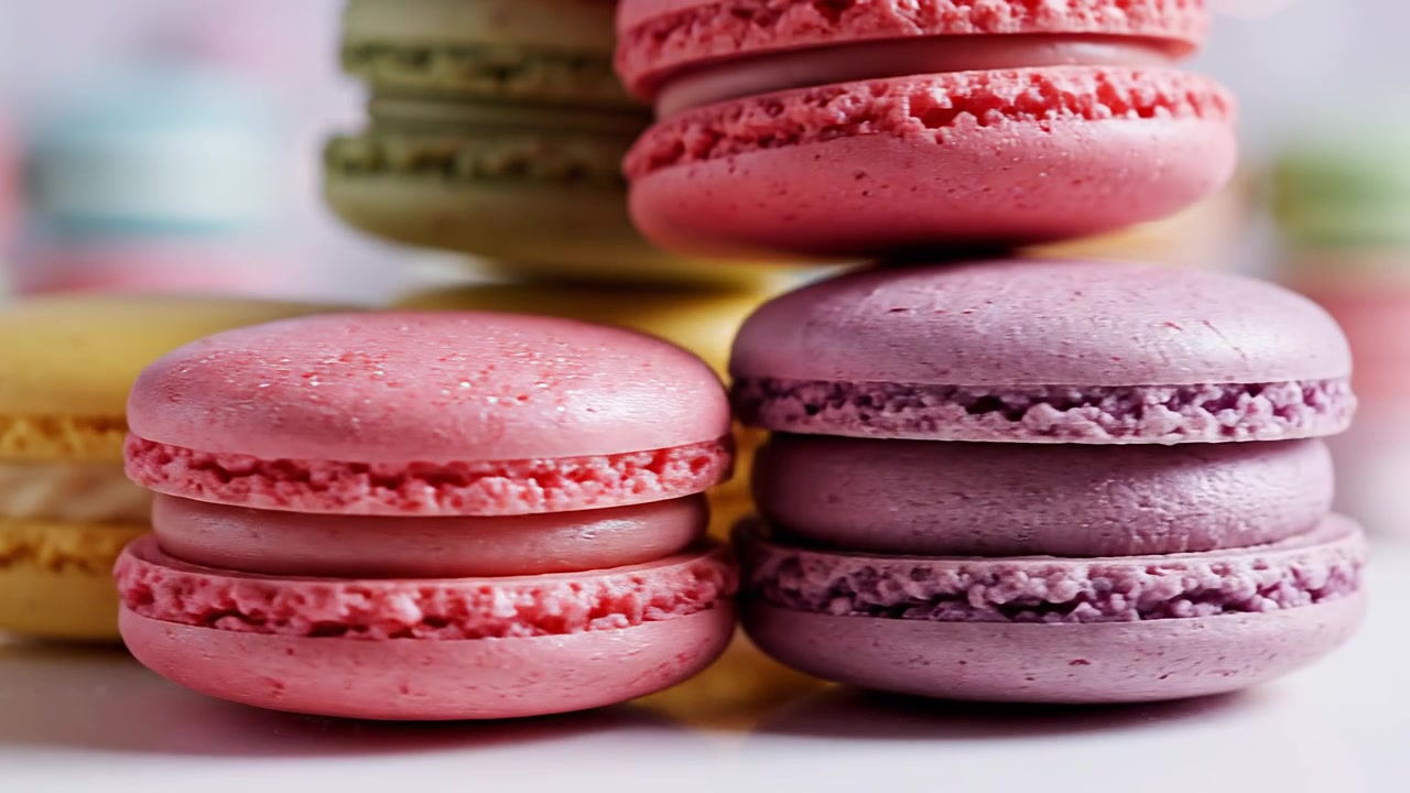 Close-up of colorful French macarons with creamy fillings