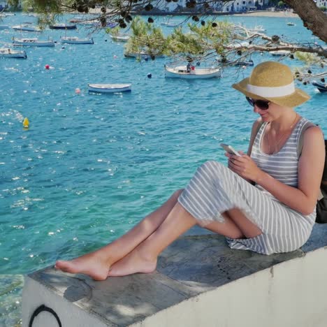 a woman rests by the sea near cadaques in catalonia 7