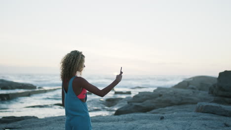 Woman,-phone-and-photo-of-beach