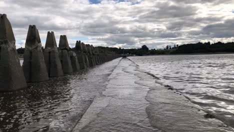 tide returning to crammond island and covering the path with water, edinburgh, scotland