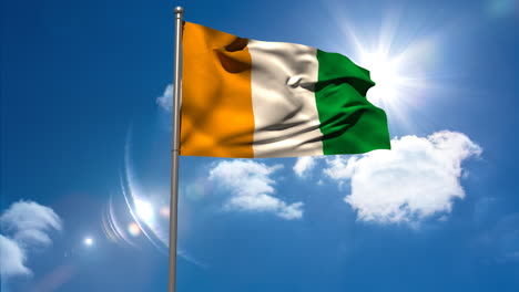 ivory coast national flag waving on flagpole