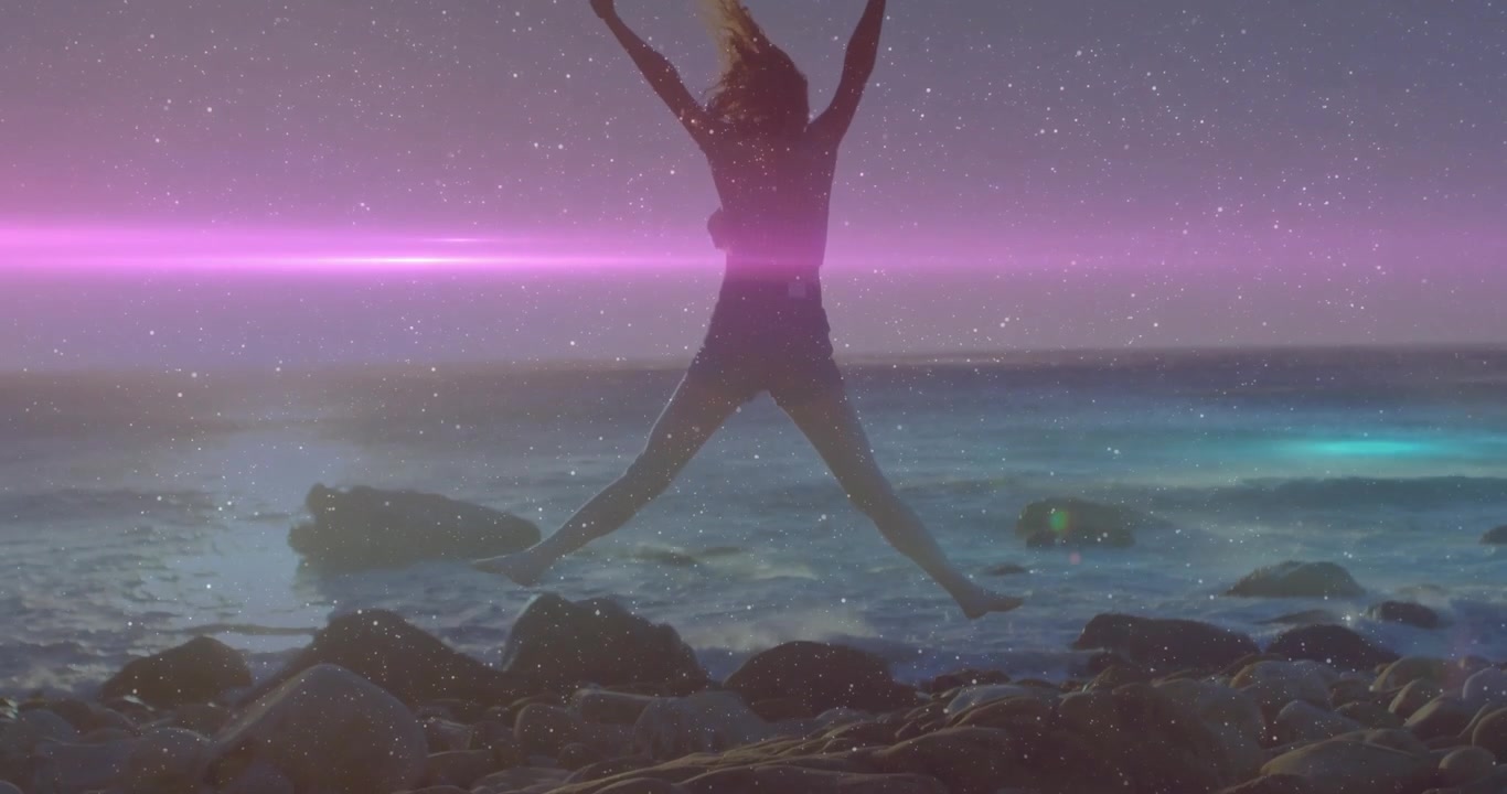 Lens flare sweeping, revealing woman springing into star jump and shifting posture for lifestyle