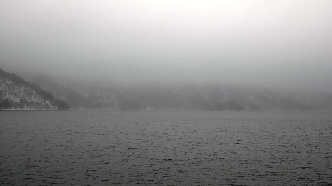 Looking out over the winter fog and mist hanging over Lake Chuzenji, Nikko, Tochigi, Japan.