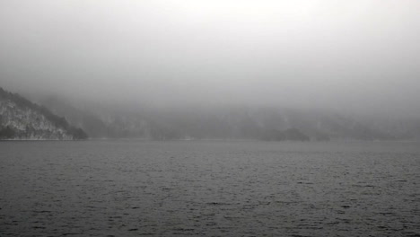 Looking out over the winter fog and mist hanging over Lake Chuzenji, Nikko, Tochigi, Japan.