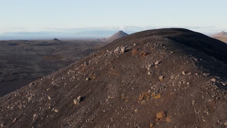 dormant volcano cones in wild rugged iceland landscape, aerial