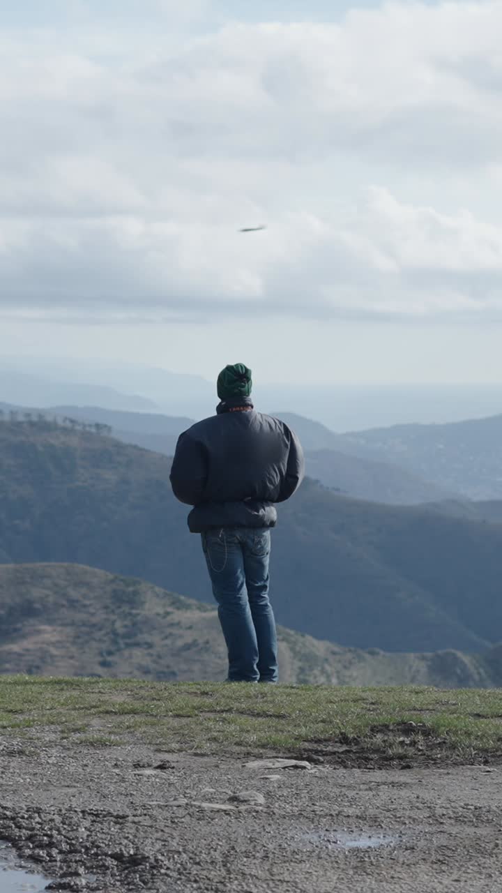 Man overlooking mountains