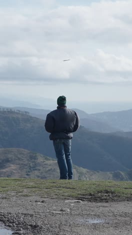 man overlooking mountains