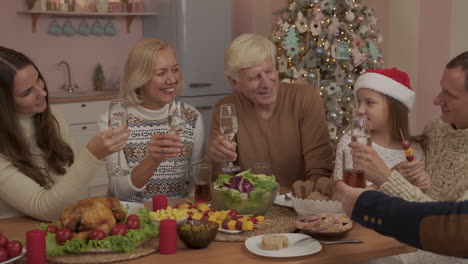 happy family together toasting and celebrating christmas dinner 1