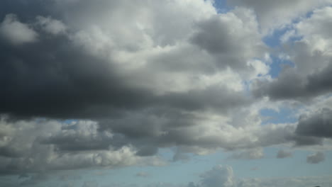 dark underside of moving cumulonimbus clouds. time lapse