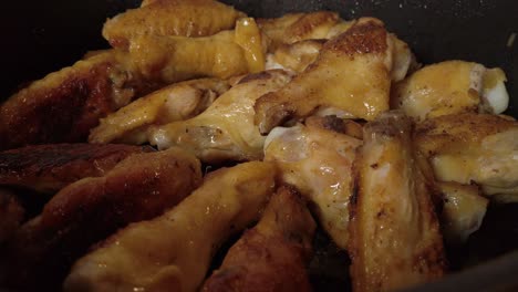 chicken wings cooking evenly in pan