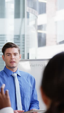 businessman giving a presentation in a meeting