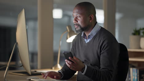 computer, phone and a business man in his office