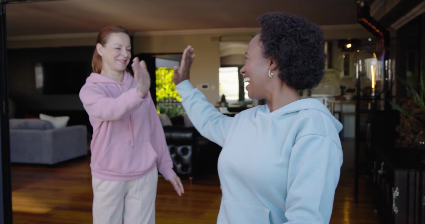 Diverse women duo breathing at sliding door African American woman in hoodie tapping watch to time