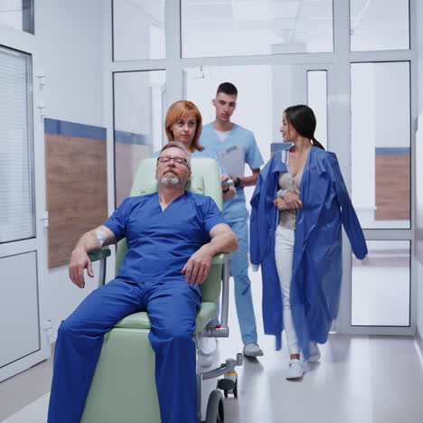 patient in the wheelchair at hospital. nurse pushing a wheelchair with a senior man along the corridor. young doctor talking to a woman in clinic.
