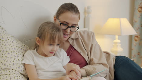 mother and daughter reading together
