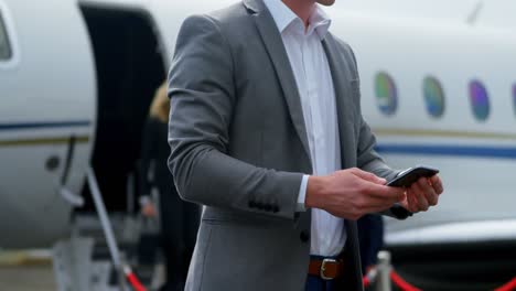 businessman using mobile phone at terminal 4k